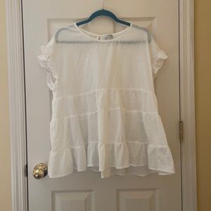 white ruffled top